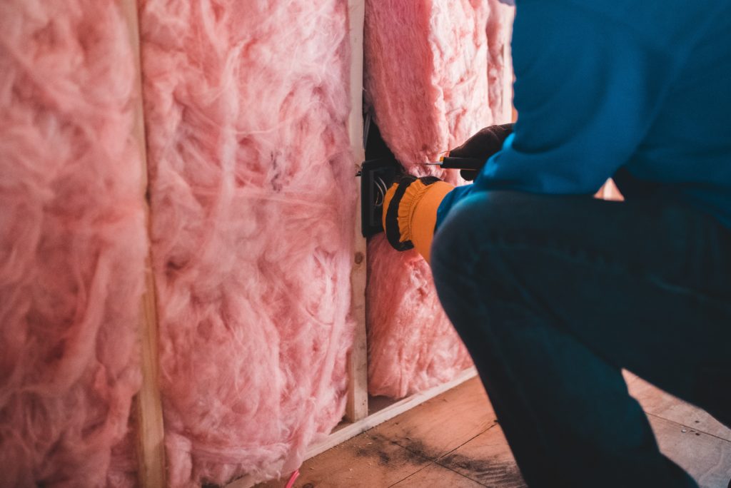 installing pink wall insulation
